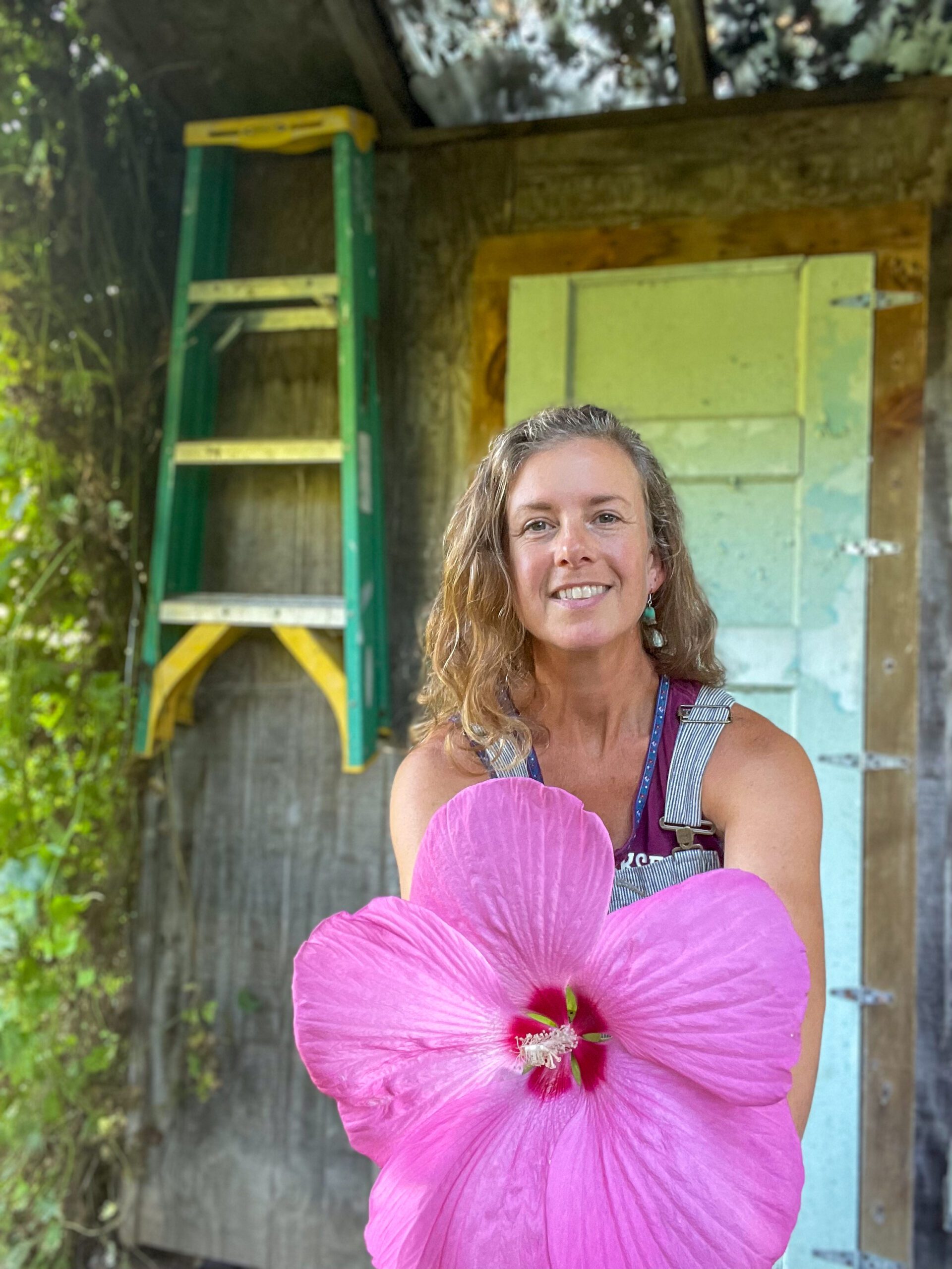 Jenny Prince with hibiscus flower in from her garden