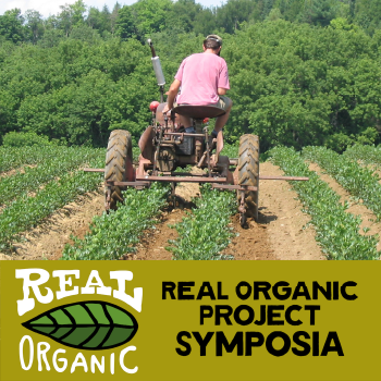 A "REAL ORGANIC PROJECT SYMPOSIA" graphic next to a person driving a tractor in a field of crops.