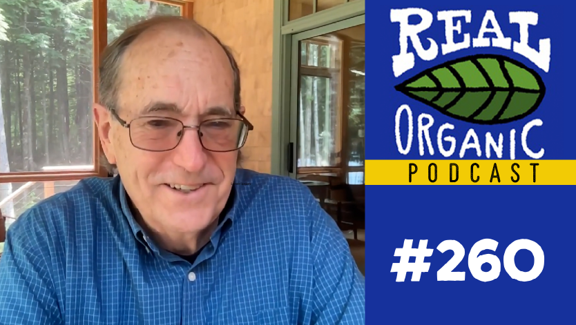 Chuck Benbrook sitting in his living room being interviewed by Dave Chapman