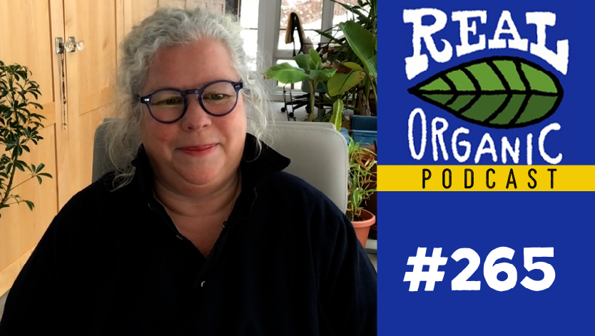 Maria Rodale surrounded by house plants in her home