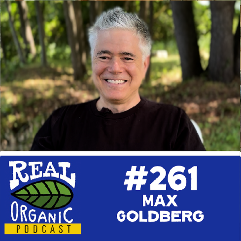 Max Goldberg smiles in a black t shirt at outside Long Wind Farm in East Thetford, Vermont