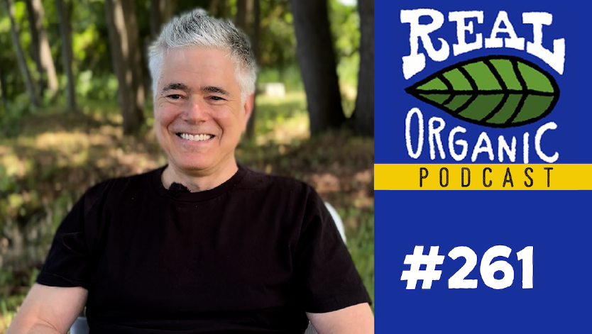 Max Goldberg smiles in a black t shirt at outside Long Wind Farm in East Thetford, Vermont