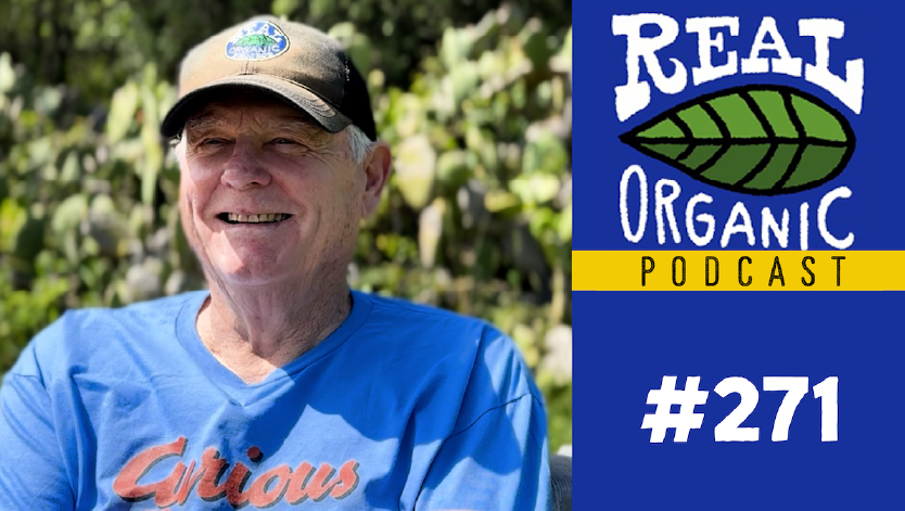 Jim Cochran smiles in a blue curious george t shirt